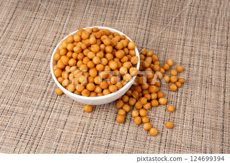Small pastry balls, fried crispy wheat soup pearls, salad egg puffs or choux pastry Small pastry balls, fried crispy wheat soup pearls, salad egg puffs or choux pastry 124699394