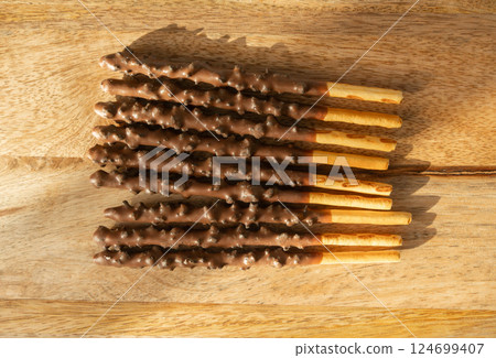 Chocolate cookie sticks, long choco pastries, japan biscuit tubes, korea cracker sticks Chocolate cookie sticks, long choco pastries, japan biscuit tubes, korea cracker sticks 124699407