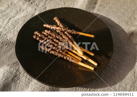 Chocolate cookie sticks, long choco pastries, japan biscuit tubes, korea cracker sticks 124699411