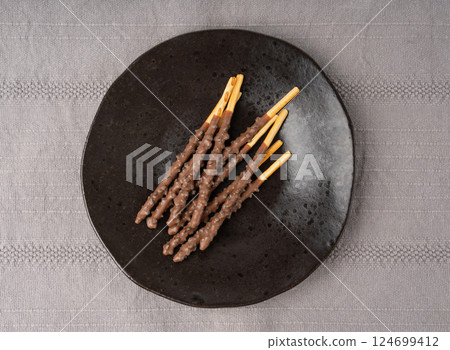 Chocolate cookie sticks, long choco pastries, japan biscuit tubes, korea cracker sticks Chocolate cookie sticks, long choco pastries, japan biscuit tubes, korea cracker sticks 124699412