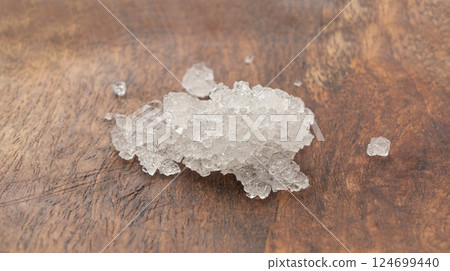 Dead sea salt pile, white crystals for body spa, sodium chloride similar to crushed ice, spa scrub 124699440