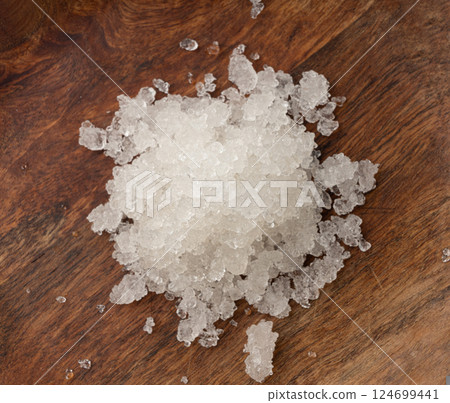 Dead sea salt pile, white crystals for body spa, sodium chloride similar to crushed ice, spa scrub 124699441