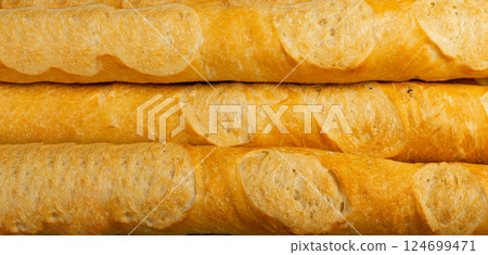 French baguette texture background, long bread loaf pattern, fresh cereal detailed buns banner French baguette texture background, long bread loaf pattern, fresh cereal detailed buns banner 124699471