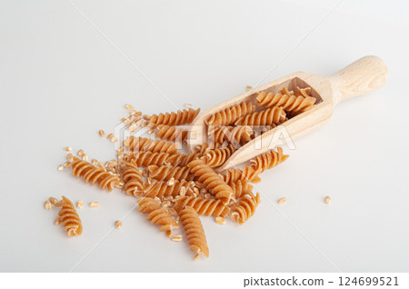 Raw Brown Pasta, Wholegrain Fusilli, Dry Whole Grain Noodle, Raw Spelt Macaroni, Healthy Italy Food 124699521