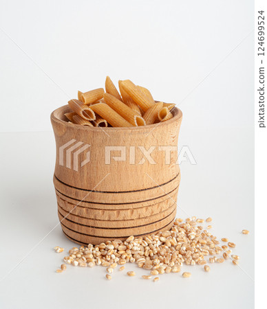 Raw Brown Pasta, Wholegrain Penne, Dry Whole Grain Noodle, Raw Spelt Macaroni, Healthy Italy Food 124699524
