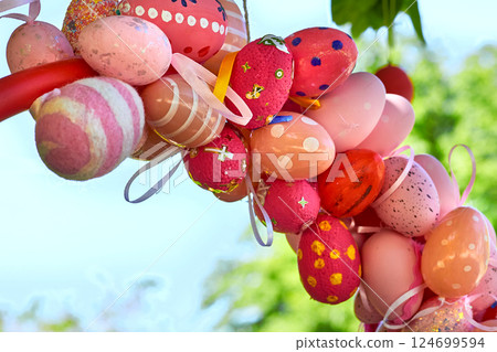 Red pink spring bouquet of colorful painted Easter eggs on green tree Red pink spring bouquet of colorful painted Easter eggs on green tree 124699594