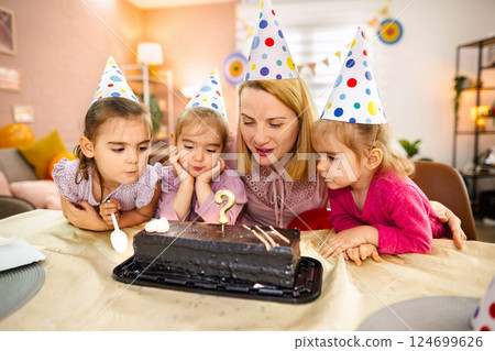 Joyful gathering of friends celebrating a special birthday moment Joyful gathering of friends celebrating a special birthday moment 124699626