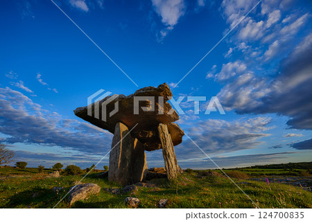 Sunset over Poulnabrone dolmen an ancient portal tomb in the Burren, County Clare, in the west of Ireland. 124700835