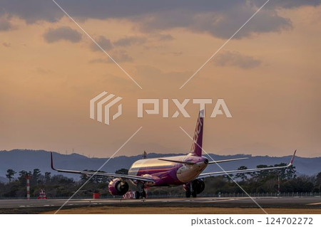 Sendai Airport at dusk, airplane taking off, Natori City, Miyagi Prefecture 124702272