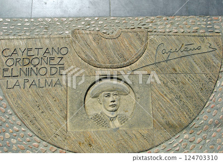 Spain, Andalusia, Ronda, Bullring, tiles of famous bullfighters on the ground in the square 124703310