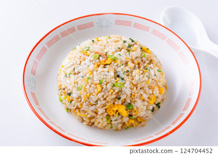 Eating fried rice at a Chinese restaurant Eating fried rice at a Chinese restaurant 124704452