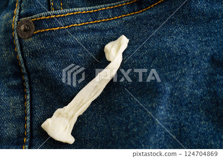Dirty chewing gum stain removal on cloth jean accident to wash with washing powder, cleaning housework. Dirty chewing gum stain removal on cloth jean accident to wash with washing powder, cleaning housework. 124704869
