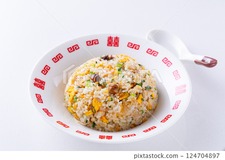 Eating fried rice at a Chinese restaurant 124704897