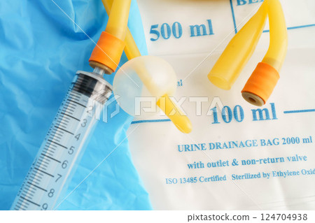 Foley catheter and urine drainage bag collect urine for disability or patient in hospital. 124704938