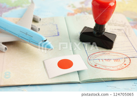 Japan passport with approved stamp on document for tourism to immigration at airport in country. Japan passport with approved stamp on document for tourism to immigration at airport in country. 124705065