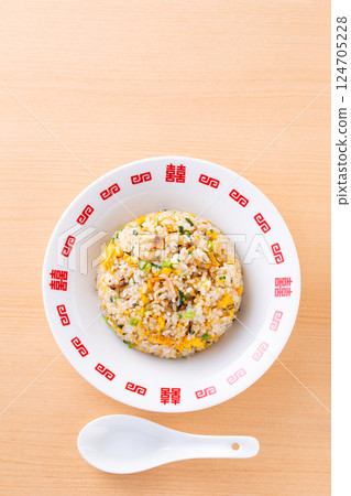 Eating fried rice at a Chinese restaurant Eating fried rice at a Chinese restaurant 124705228