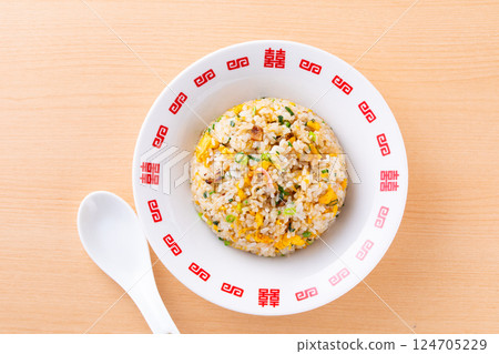 Eating fried rice at a Chinese restaurant Eating fried rice at a Chinese restaurant 124705229