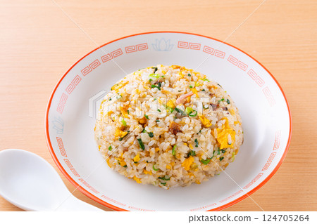 Eating fried rice at a local Chinese restaurant 124705264