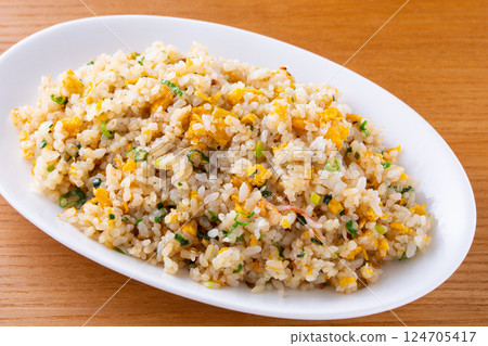 Eating fried rice at a local Chinese restaurant 124705417