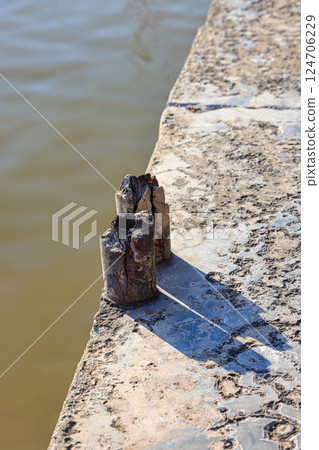 Cracked Reinforced concrete bridge railing visible internal reinforcement, Broken or weak concrete. Cracked Reinforced concrete bridge railing visible internal reinforcement, Broken or weak concrete. 124706229