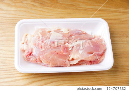 Raw young chicken thighs 124707882
