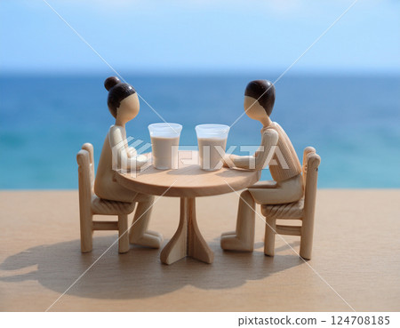 在咖啡館欣賞海景的微型人 在咖啡館欣賞海景的微型人 124708185