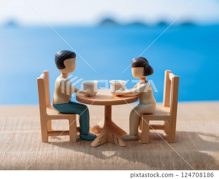 在咖啡館欣賞海景的微型人 124708186