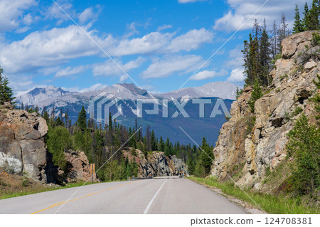 Yellowhead Highway in Jasper National Park, Alberta, Canada. Roche Bonhomme mountain summit in the background. Yellowhead Highway in Jasper National Park, Alberta, Canada. Roche Bonhomme mountain summit in the background. 124708381