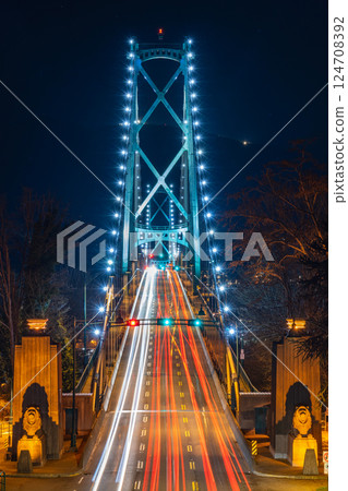 Lions Gate Bridge at night. Cars driving on the bridge with long exposure. Stanley Park, Vancouver, British Colombia, Canada. Lions Gate Bridge at night. Cars driving on the bridge with long exposure. Stanley Park, Vancouver, British Colombia, Canada. 124708392