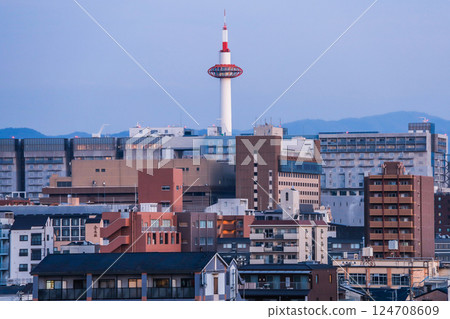 Kyoto Tower in the morning seen through the buildings Kyoto Tower in the morning seen through the buildings 124708609