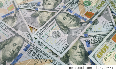 A sizable pile of freshly minted one hundred dollar bills ready for transactions and trade A sizable pile of freshly minted one hundred dollar bills ready for transactions and trade 124708663
