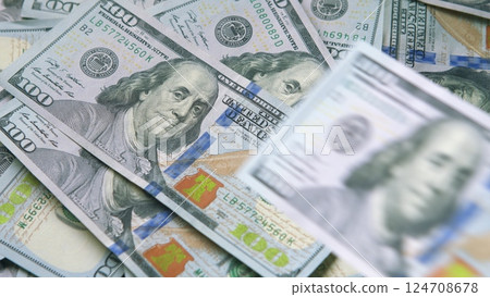 A Detailed and CloseUp View of Neatly Stacked U.S. Dollar Bills Can Be Observed Here 124708678