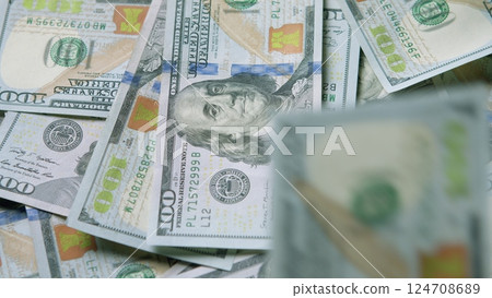 A CloseUp Photograph Featuring Stacks of United States Currency Money in Detail 124708689
