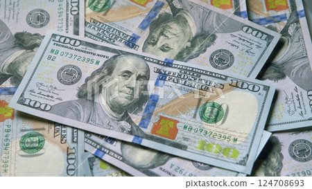 Various Currency Bills are Stacked Together, Highlighting the Prominence of Hundred Dollar Notes 124708693