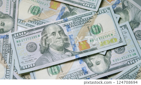 Stacks of cash consisting of US Hundred Dollar Bills, representing financial wealth and assets 124708694
