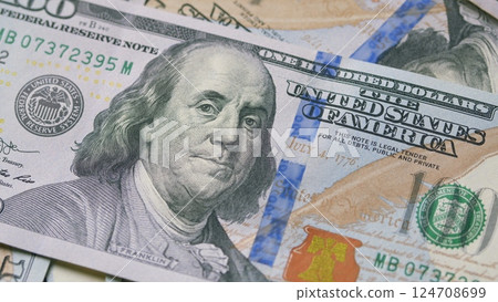 Closeup of U.S. Hundred Dollar Bills showcasing their design, texture, and significance 124708699