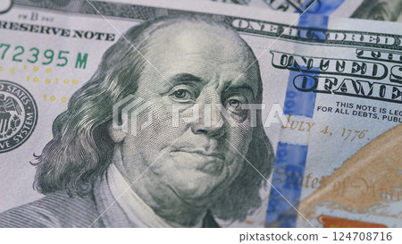 Closeup image of a Benjamin Franklin Hundred Dollar Bill showing intricate designs 124708716