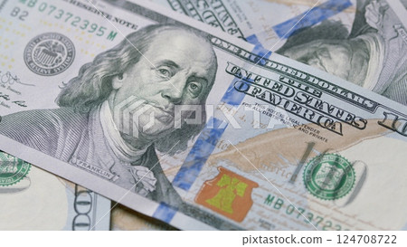 A CloseUp View of Various Hundred Dollar Bills Showing Their Intricate Design Details 124708722