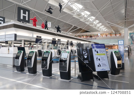 Check-in counters with baggage tag issuing machines 124708851