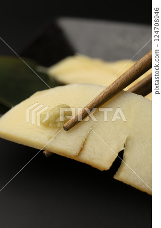 Pick up the bamboo shoot sashimi with chopsticks 124708946