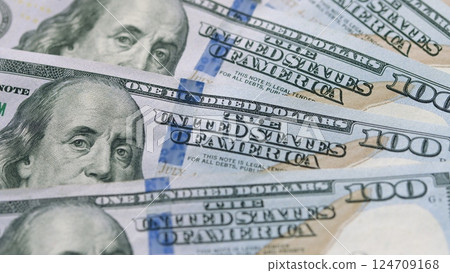 A CloseUp Image of U.S. One Hundred Dollar Bills and Their Significance in Finance and Commerce A CloseUp Image of U.S. One Hundred Dollar Bills and Their Significance in Finance and Commerce 124709168