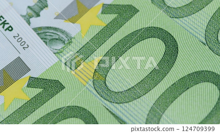CloseUp View of Euro Banknotes, Highlighting Their Unique Design and Intricate Details CloseUp View of Euro Banknotes, Highlighting Their Unique Design and Intricate Details 124709399