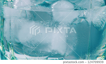 A Refreshing Glass of Ice Water Filled with Crisp Ice Cubes, Perfect for a Hot Day A Refreshing Glass of Ice Water Filled with Crisp Ice Cubes, Perfect for a Hot Day 124709939