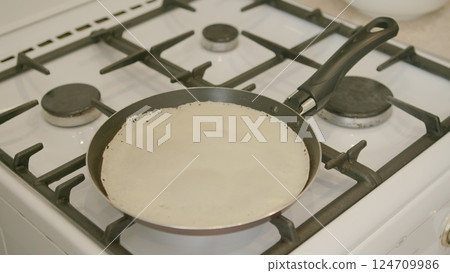 Cooking Delicious Pancakes Using a Gas Stove That Makes Breakfast or Brunch Extra Special 124709986