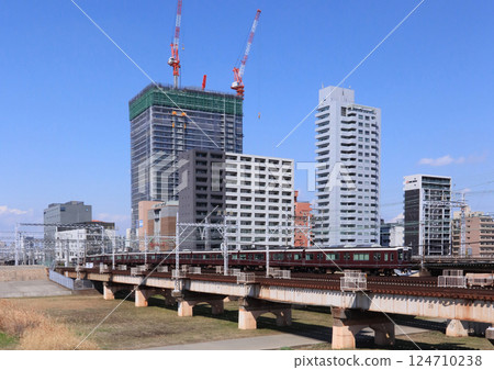 Hankyu train crossing the Yodo River Hankyu train crossing the Yodo River 124710238