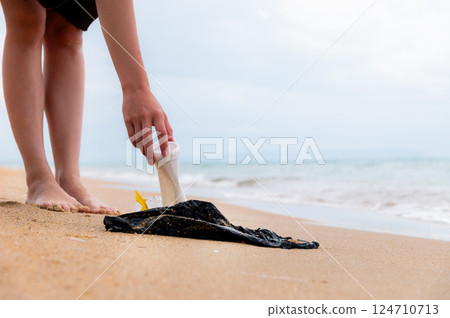 Beach pollution. Plastic bottles and other trash on sea beach. Ecological concept. earth day concept. globe pollution. Garbage on beach. Plastic at the ocean Beach pollution. Plastic bottles and other trash on sea beach. Ecological concept. earth day concept. globe pollution. Garbage on beach. Plastic at the ocean 124710713