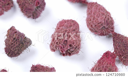 A closeup view of the unique and textured maroon structures formed by various plant species A closeup view of the unique and textured maroon structures formed by various plant species 124710980