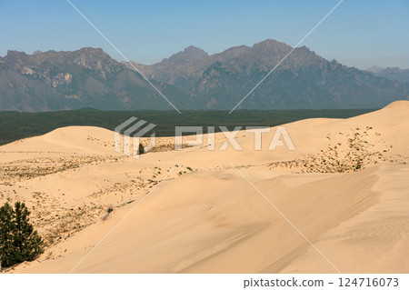 Kodar mountain range and Chara sands. Kodar mountain range and Chara sands. 124716073
