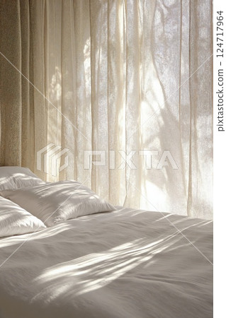 Serene minimalist bedroom with soft sunlight through sheer curtains for relaxation and interior inspiration 124717964