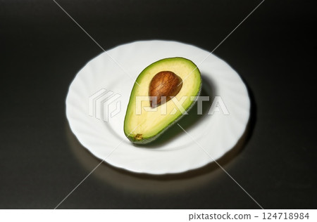 Avocado on a black background Avocado on a black background 124718984